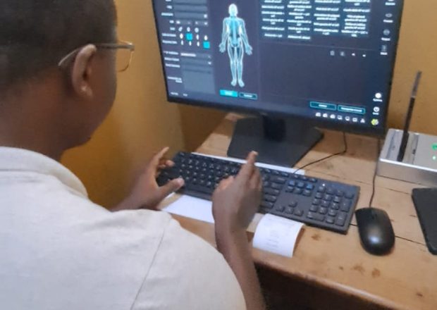 Radiographer selecting an examination on the digital radiography acquisition console